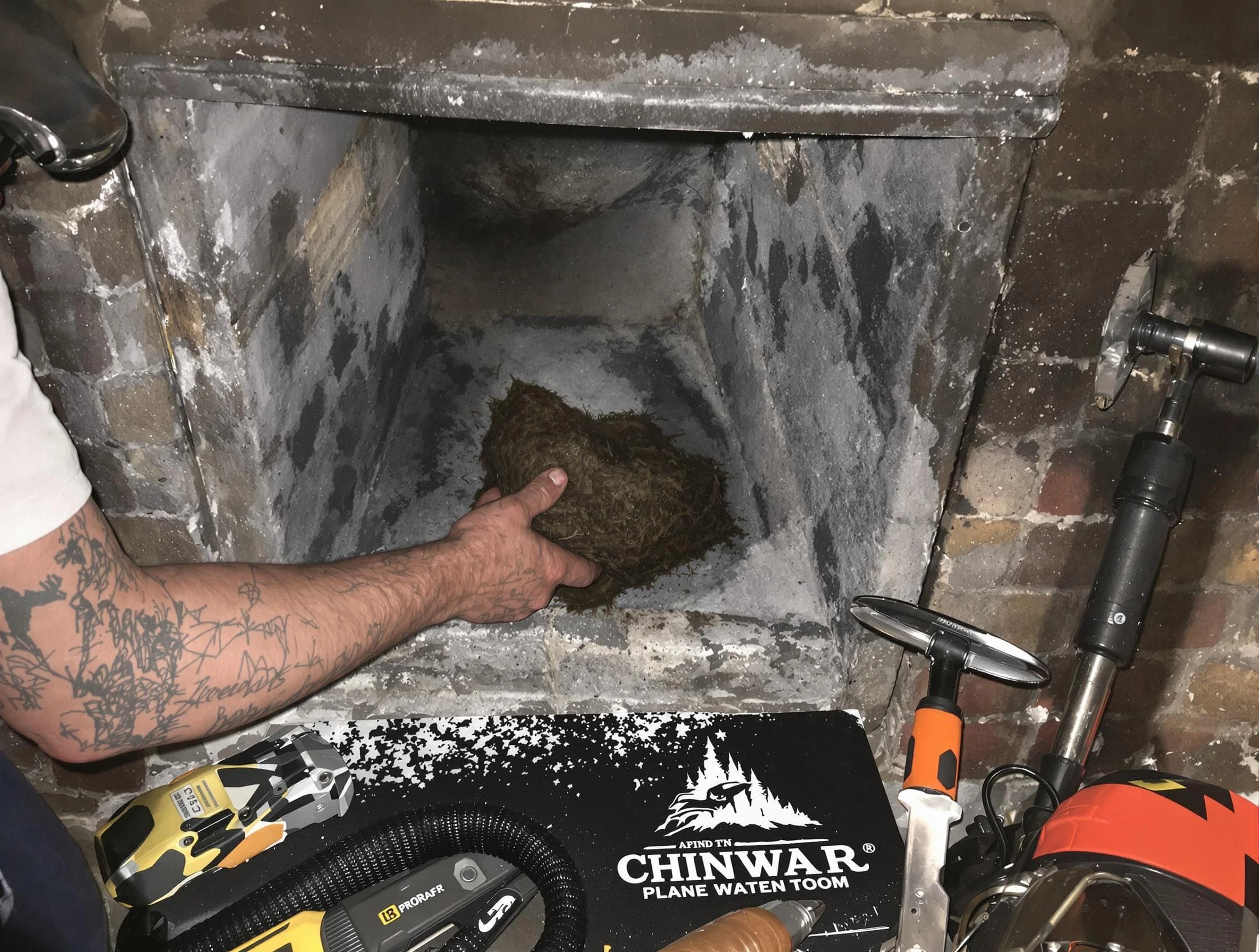 Herriman Chimney Sweep safely removing debris and screening chimney in Herriman, UT